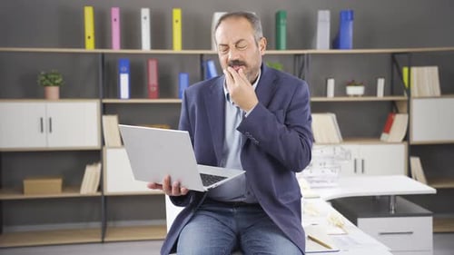 Man Using Laptop in Office Workplace