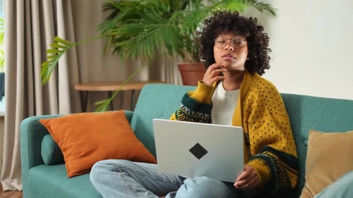 African American Girl Using Laptop at Home Office Looking at Screen Typing Chatting Reading Writing