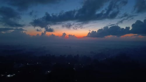Dramatic Dusk Sky Over Dark Landscape With Hints Of A Village