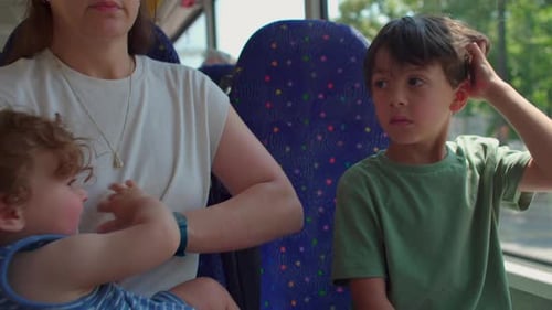 Mother and Two Boys on Bus Public Transport