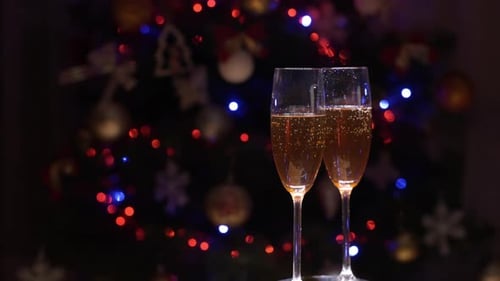 Festive Champagne Glasses with Christmas Tree Lights