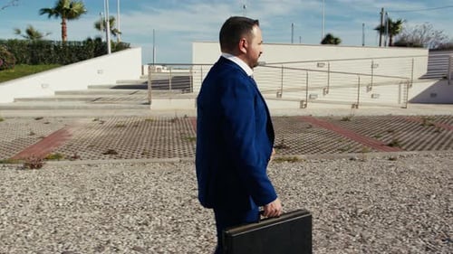 Businessman Walking With The Suitcase Going To Work