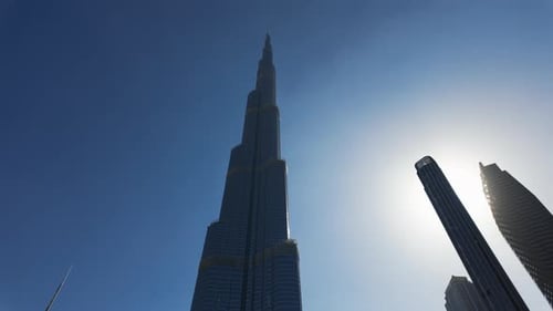 Burj Khalifa in the city of Dubai, United Arab Emirates. Action. Low angle view of a giant skyscrape