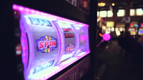 Playing Modern Slot Machine Game in the Las Vegas Casino.