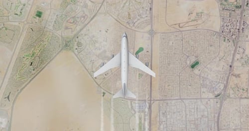 Aerial View of Airplane Flying Over Satellite Map