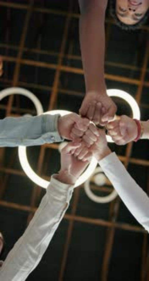 People, hands and teenagers with fist bump in circle together for education or learning below