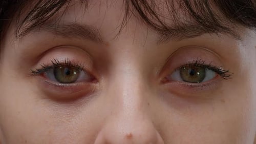 Young Woman Opens and Closes Eyes