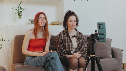 Two Friends Talking on Camera at Home