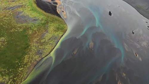 Aerial view of a river along the coast in Iceland.
