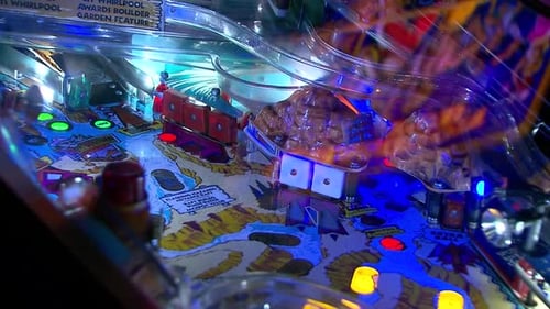 Interior View of Vintage Pinball Machine with Flashing Lights