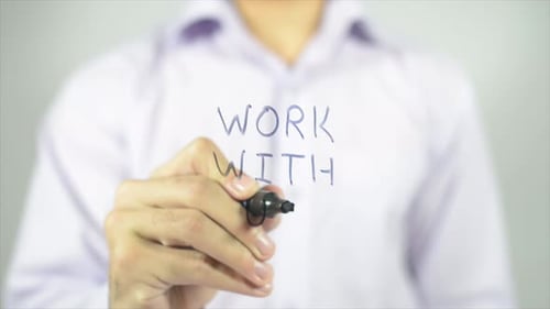 Writing "Work With Us" On Clear Surface