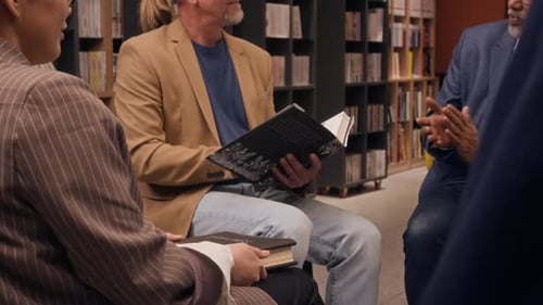 People in a Book Club Meeting in a Library