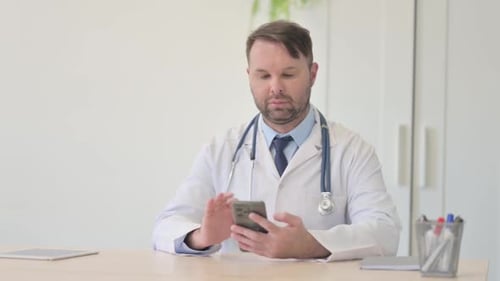Doctor Using Smartphone in Modern Clinic Office
