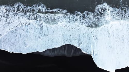 Abstract Pattern in Nature Aerial View of Black Sand Volcanic Beach with Crashing Waves Surreal