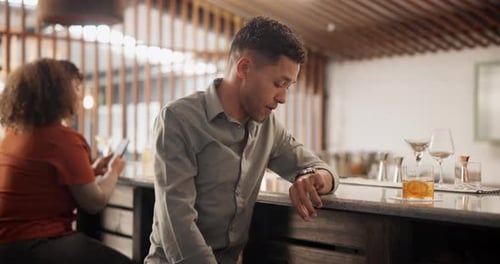 Bar, drink or time and man waiting for blind date at counter with annoyed or impatient attitude