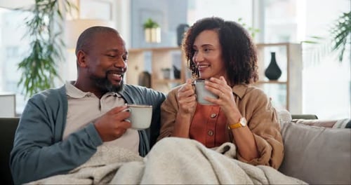 Smiling Couple Relaxing at Home Together