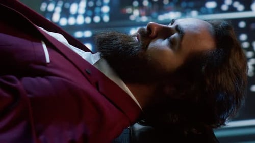 Man in Dark Red Suit Opens Eyes