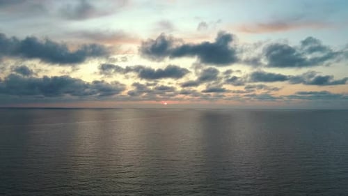 Dron Flying Over Sea in a Beautiful Sunset. Sunrise Over the Sea. Colorful Sunset on the Baltic Sea