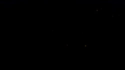 Fiery Sparks Flying Upward in the Dark