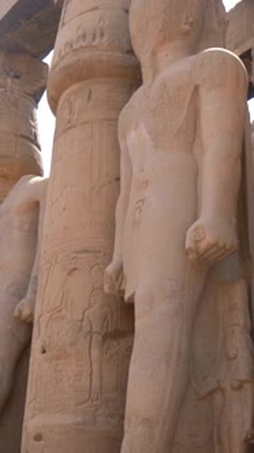 Sculptures of Pharaohs Inside the Luxor Temple and the Drawings Egyptian Columns