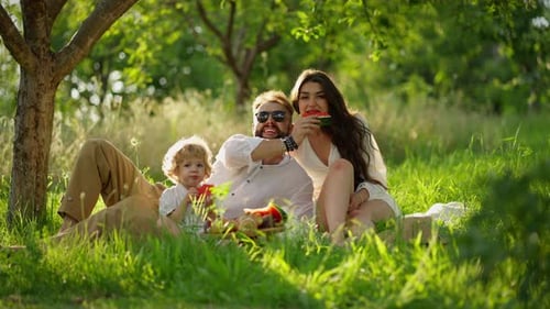 Family Relations Time to Enjoy Summer Together Family Eats Watermelon While Relaxing in Garden
