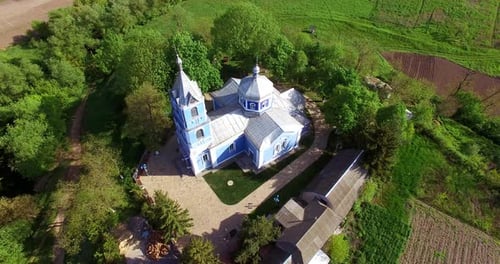 Beautiful building of a church surrounded by green trees.