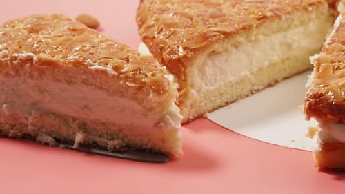 Appetizing Almond Sponge Cake with Cream Close Up