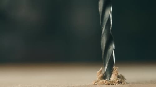 Closeup Drill Bit Boring Into Wooden Board During Construction Macro View Spiral Tool Cutting Into