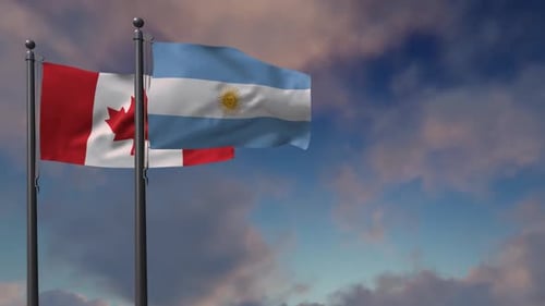 Canada and Argentina Flags Waving Against a Cloudy Sky