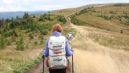 Girl Hiker Walking By The Grassy Mountain Hill 3