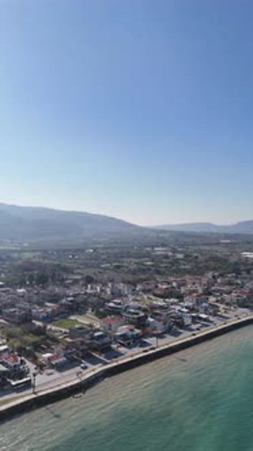 Vertical Aerial View of Guzelbahce Coastline and Residential Area in Izmir, Turkey