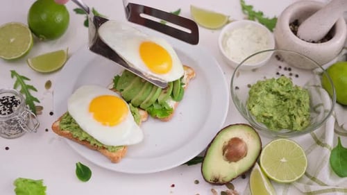 Preparing Avocado Toast with a Fried Egg Close Up