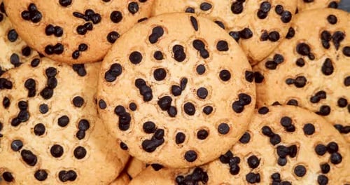 Cookies with Pieces of Dark Chocolate, Rotation. Homemade Piece Biscuit Top View Rotating Video