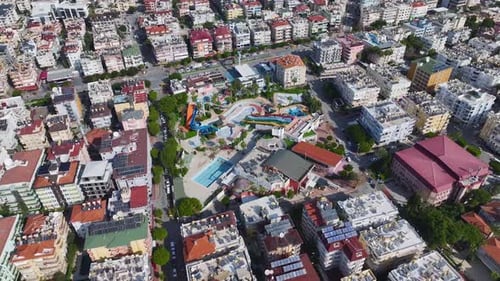 Aerial Video of an Empty Water Park With Brightly Colored Slides Still Water and No People on the