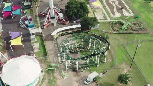 A Roller Coaster Car Rushes Through The Station