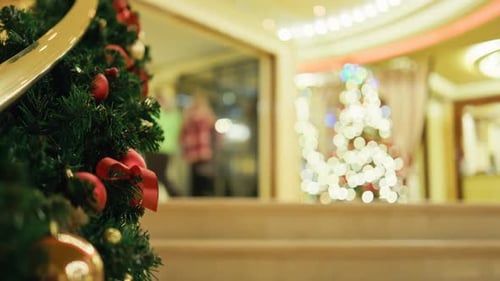 Decorated Christmas Trees in Warmly Lit Lobby
