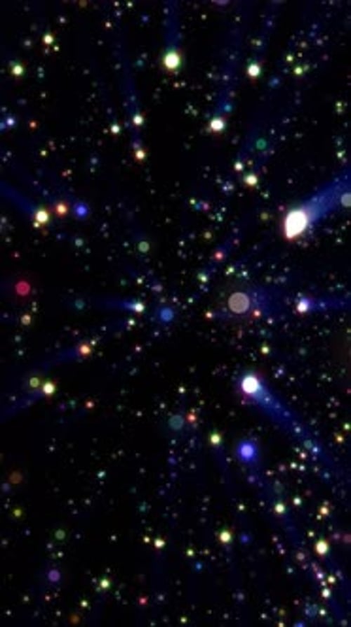 Étoiles et lumières rougeoyantes multicolores dispersées sur un fond sombre semblable à l'espace, formant