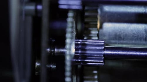 close up of an old clock mechanism clockwork gear and dial needle with a turning movement