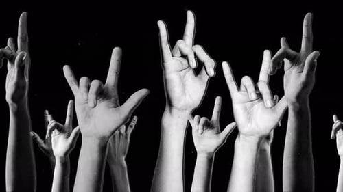 Spinning Halftone Rock Symbol Hands Background Loop