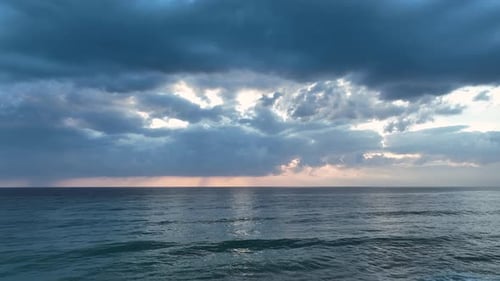 Dramatic Color of the Sea Waves Crashing Against the Rocks Aerial View on a Wild Beach