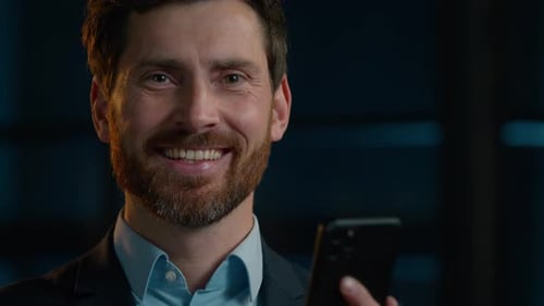 Middleaged Caucasian Man Businessman Professional CEO Employee Stand in Evening Dark Office Texting