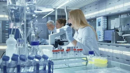 Scientists Working in a Modern Laboratory Setting