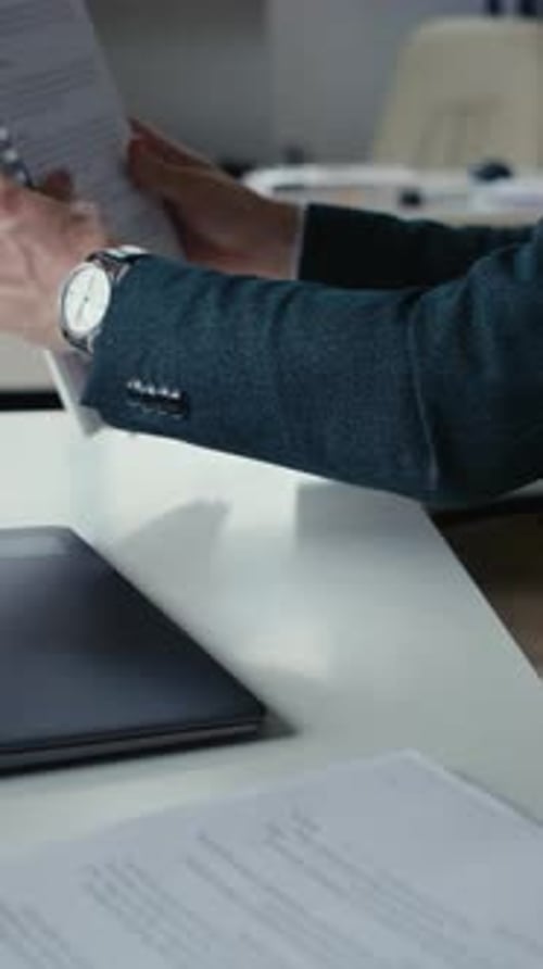 Hands Typing on Laptop in Office Environment