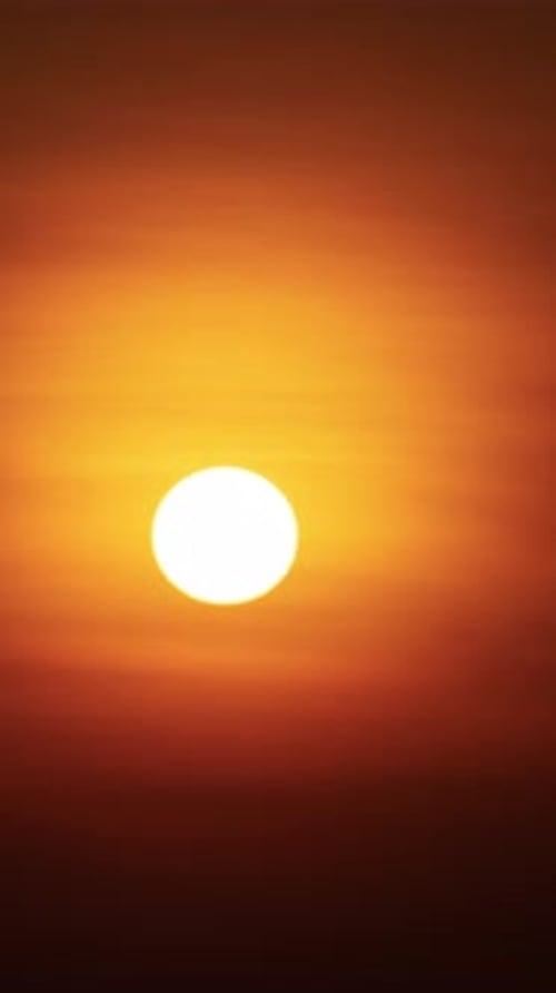 Sun Setting with Orange Sky at Golden Hour