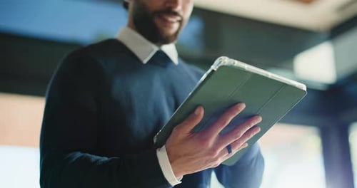 Hands, creative and man with tablet in office for research, proofreading article and update draft