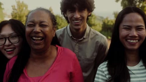 Diverse Group Laughing and Smiling Together Outdoors
