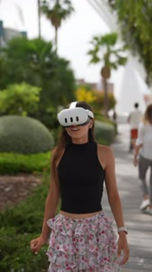 Woman Wearing VR Headset Walking in City Park