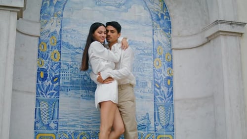 Enamoured People Embracing at Tile Architecture Close Up