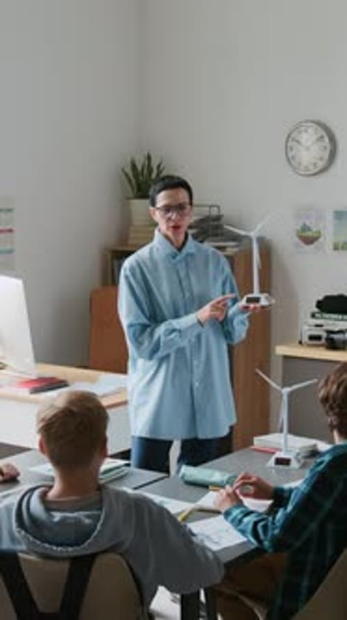 Teacher Explains Wind Turbine Model to Students