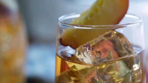 Iced Drink Garnished with Fresh Peach Slice